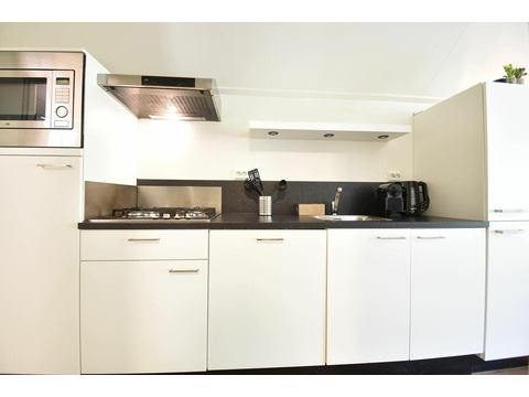 chalet-kaufen-arnhem-offene-kuche-wohnzimmer-modern-2025.webp004
