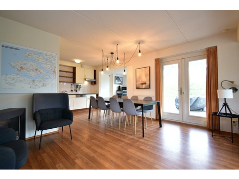 chalet-kaufen-summio-park-aquadelta-bruinisse-niederlande-wohnzimmer-essbereich-terrassentuer-2025