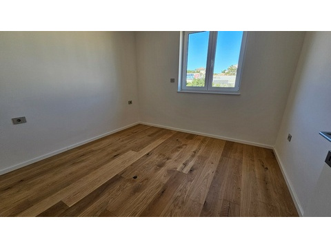Schlafzimmer mit Parkettboden